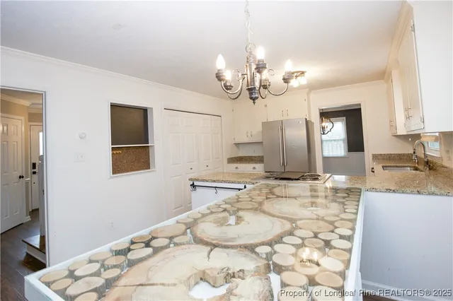 a bathroom with a granite countertop sink a mirror and a shower