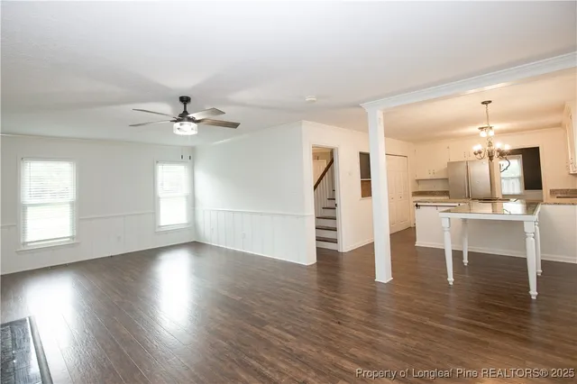 a view of kitchen with cabinets and wooden floor