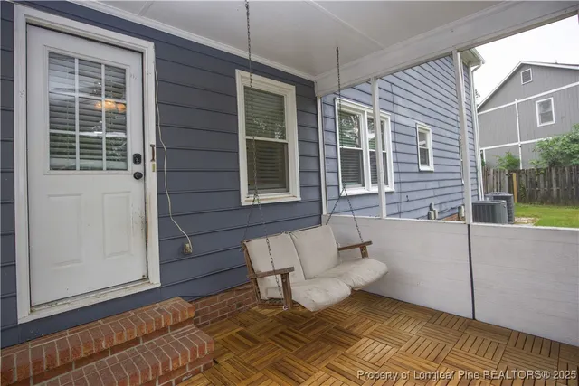 a view of a patio with couches and potted plant
