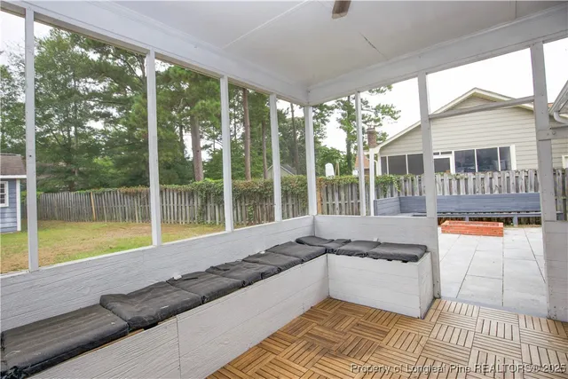 a spacious bathroom with a large window and a bath tub