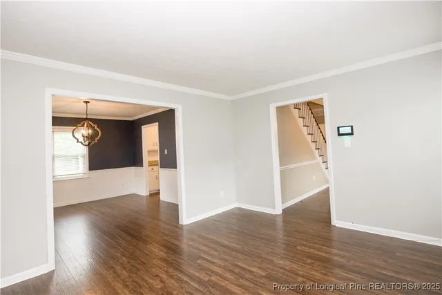 a view of hallway with wooden floor