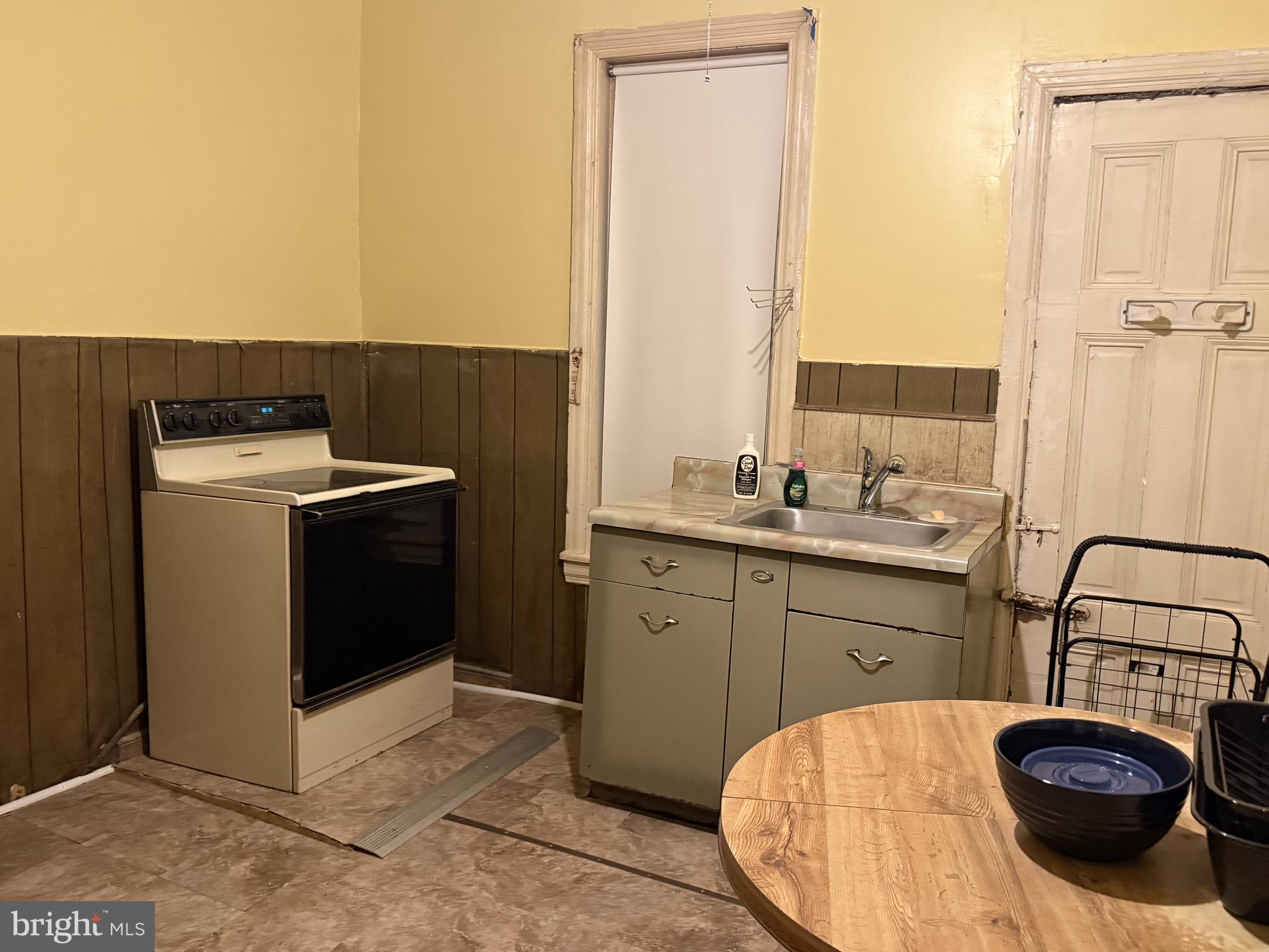 2136 North 21st Street Philadelphia, PA 19121 - Photo 16 of 17 a kitchen with a sink and a stove