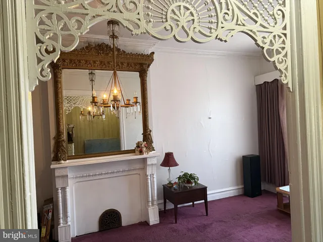 image of a door and a room with furniture