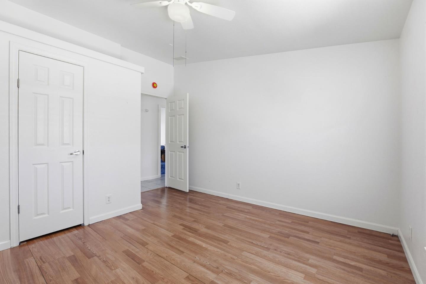 500 West 10th Street, Unit 119 Gilroy, CA 95020 - Photo 13 of 27 a view of an empty room with wooden floor