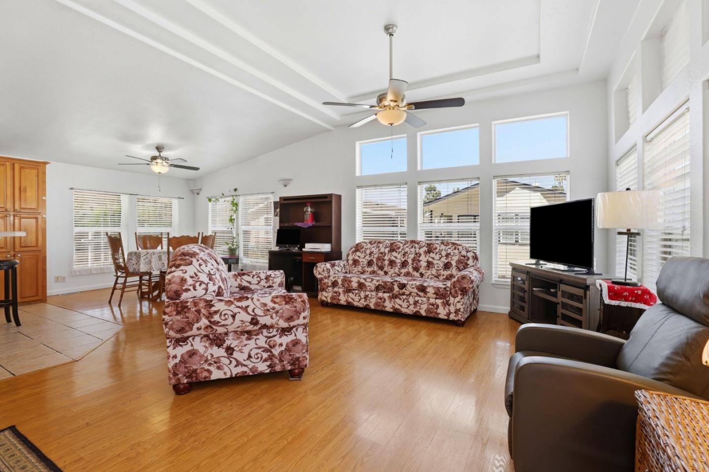 500 West 10th Street, Unit 119 Gilroy, CA 95020 - Photo 2 of 27 a living room with furniture kitchen view and a flat screen tv