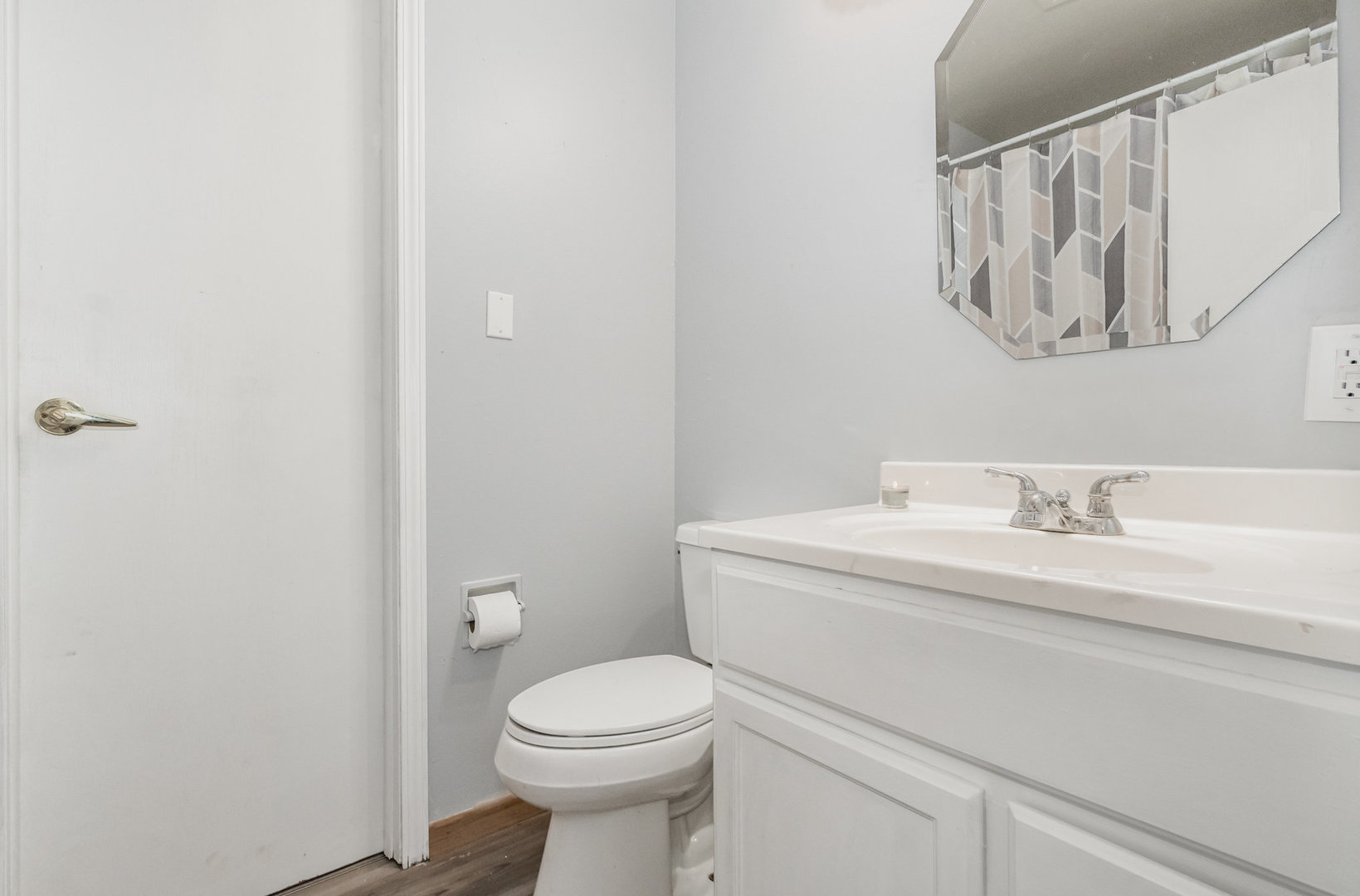 720 Union Avenue Romeoville, IL 60446 - Photo 12 of 15 a bathroom with a toilet sink vanity and mirror