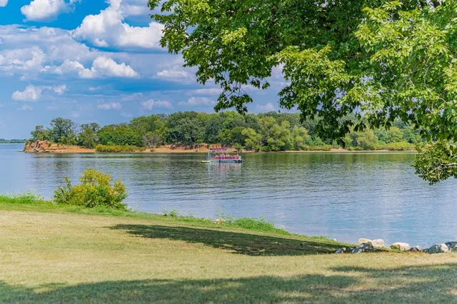 a view of a lake with a big yard