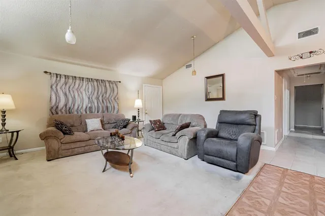 a living room with furniture and a couch