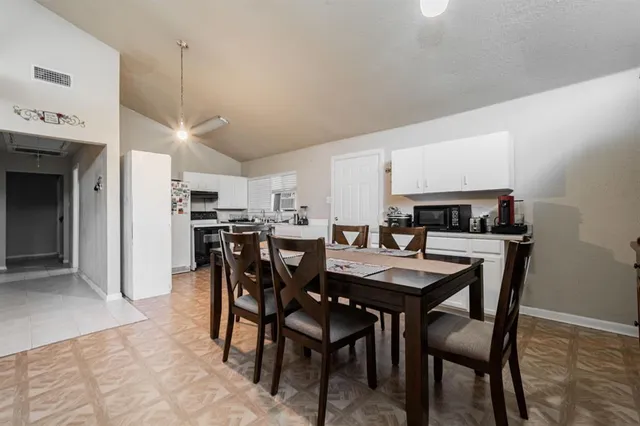 a view of a dining room with furniture