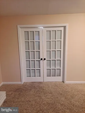 a view of a house with a large tree