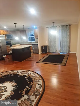 a view of kitchen with wooden floor