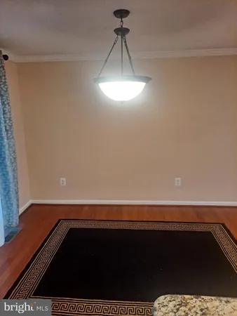 a view of an empty room and a window