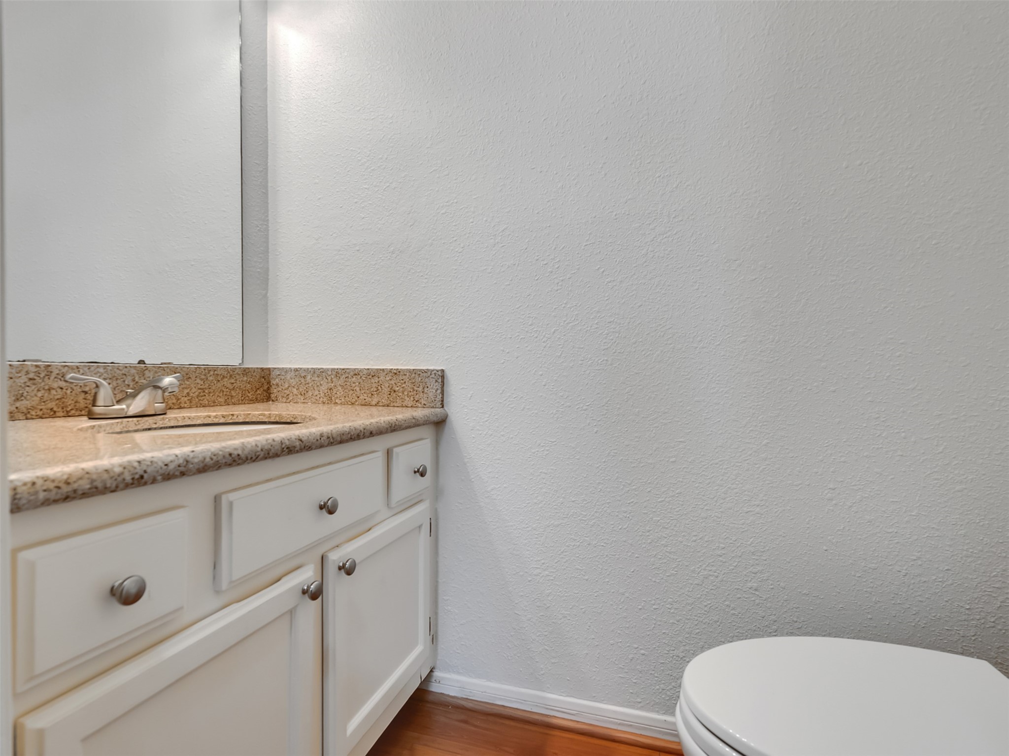 4001 Tanglewilde Street, Unit 605 Houston, TX 77063 - Photo 14 of 29 a bathroom with a granite countertop toilet and sink