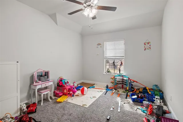 a room with toys and a chandelier