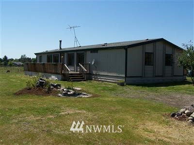 18630 Old Highway 99 Southwest Rochester, WA 98579 - Photo 1 of 1 a front view of a house with garden