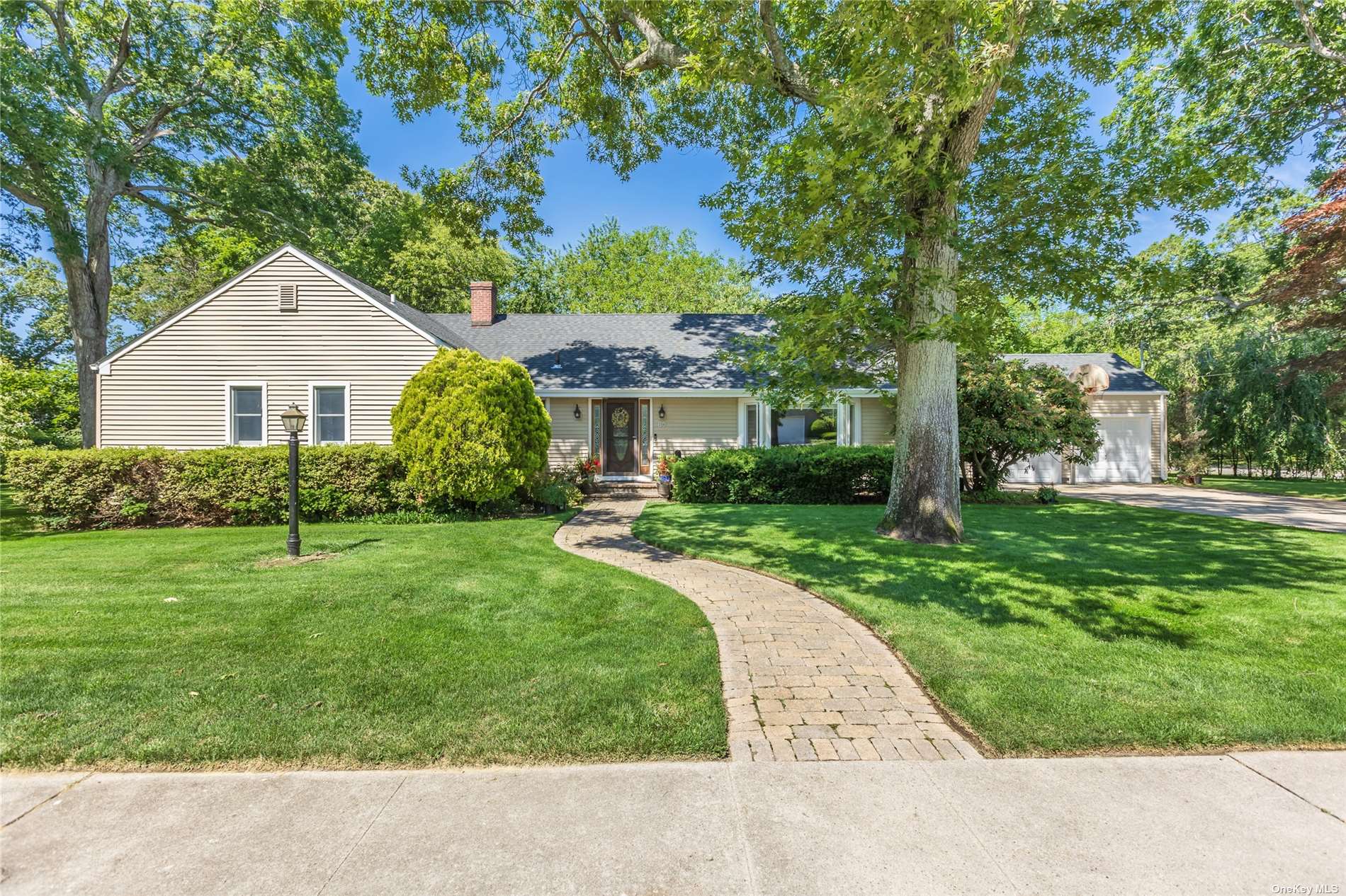 80 Ketcham Avenue Patchogue, NY 11772 - Photo 1 of 1 front view of a house with a yard
