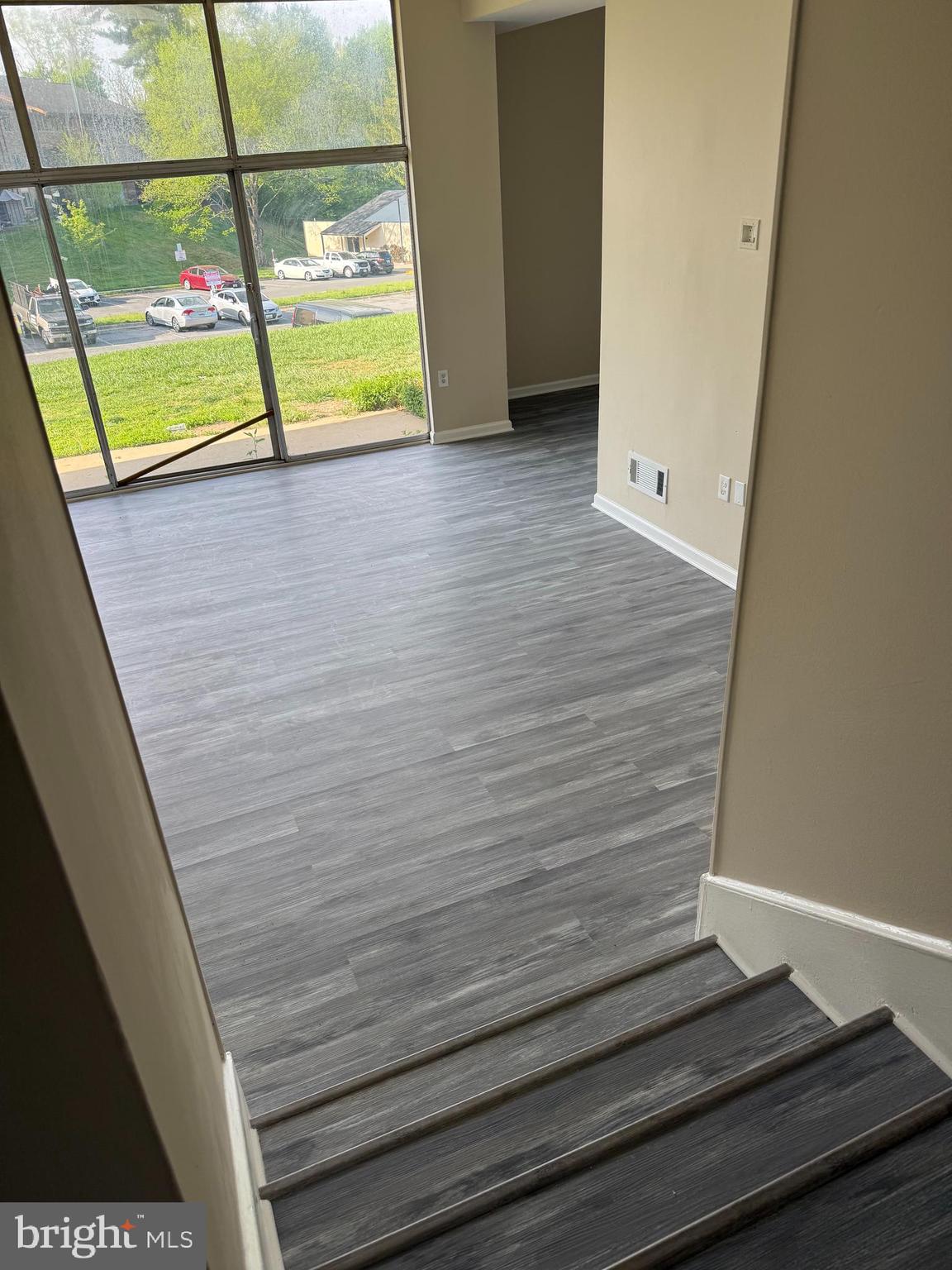 18724 Walkers Choice Road, Unit 2 Montgomery Village, MD 20886 - Photo 19 of 19 Step down to the Living Room