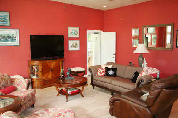 6668 Puupilo Road Kapaa, HI 96746 - Photo 6 of 23 a living room with furniture and a flat screen tv
