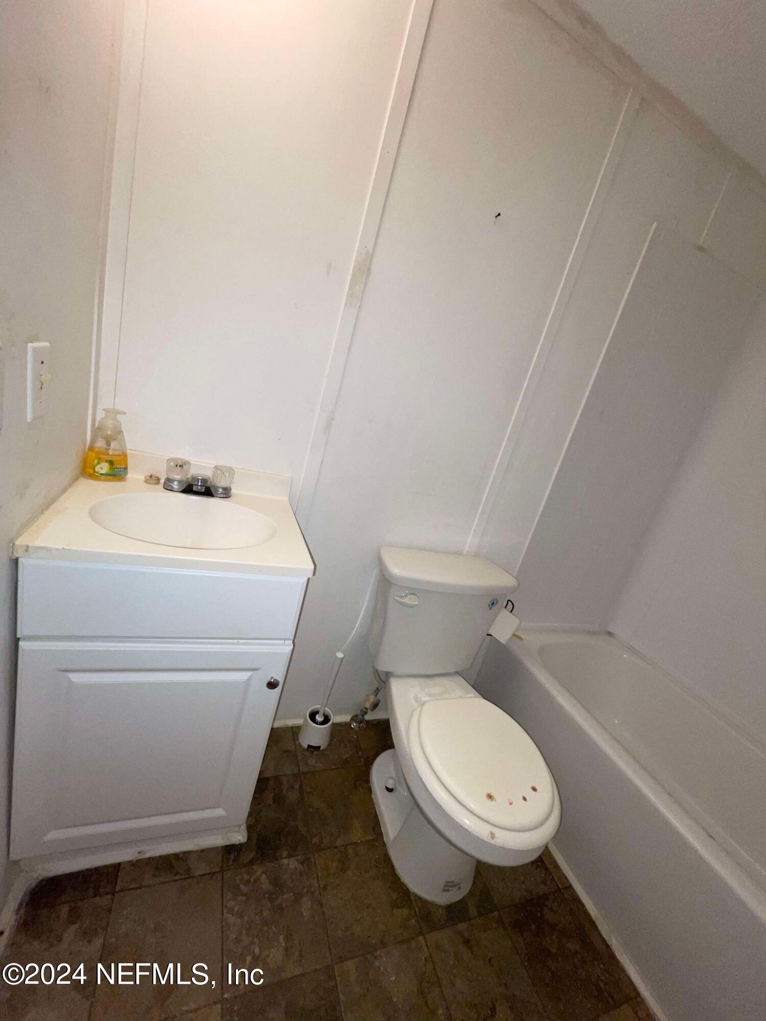 12550 Southeast 55th Place Starke, FL 32091 - Photo 25 of 29 a white toilet sitting next to a bathroom sink