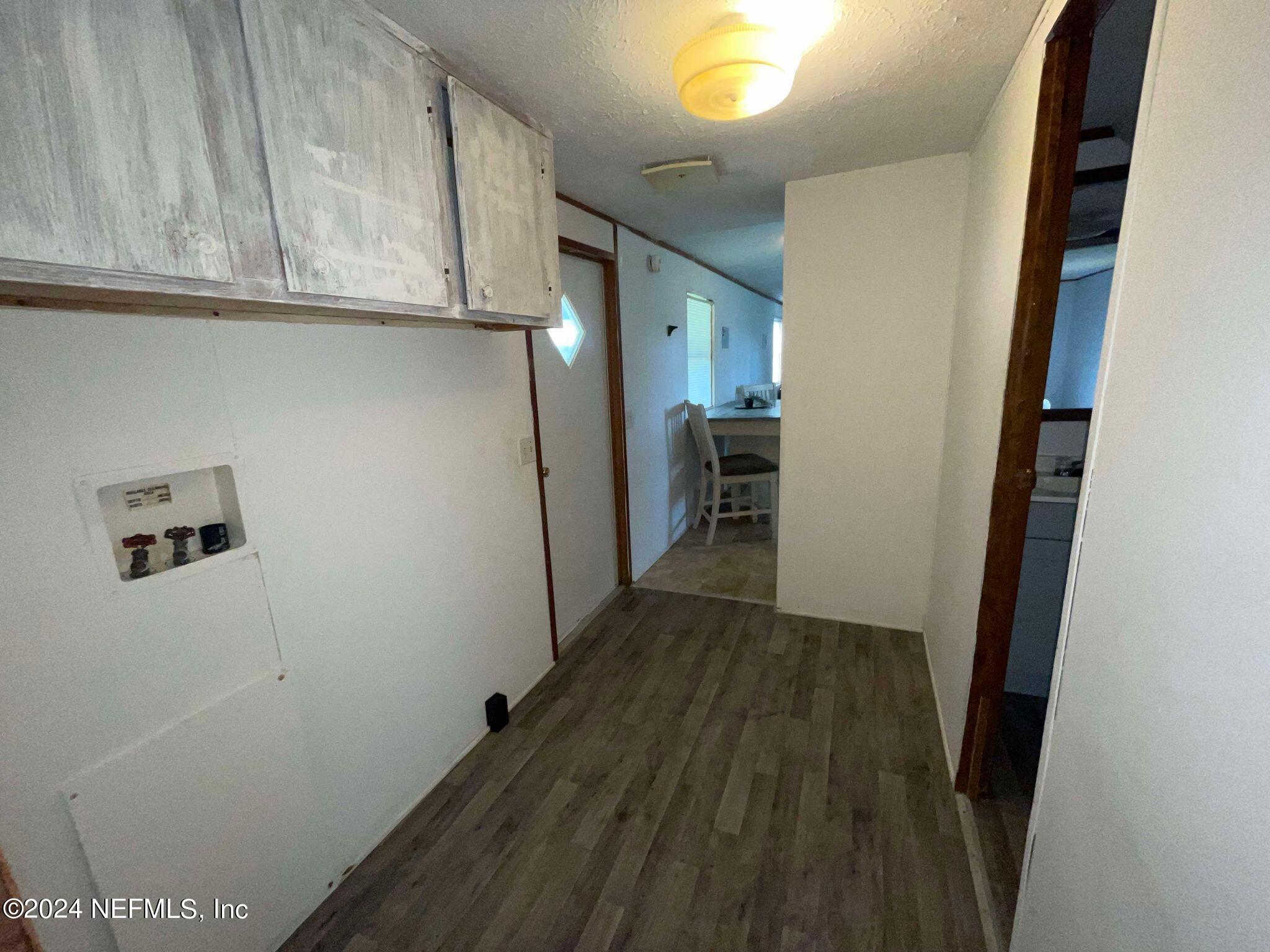 12550 Southeast 55th Place Starke, FL 32091 - Photo 7 of 29 a view of hallway with wooden floor