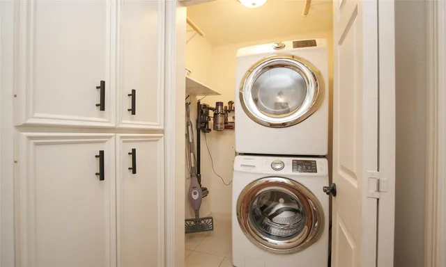a view of a hallway with washer and dryer
