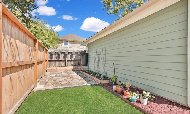 a view of a porch with a garden