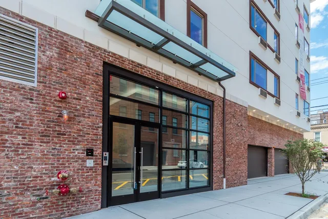 a view of a dining room with furniture wooden floor and a chandelier