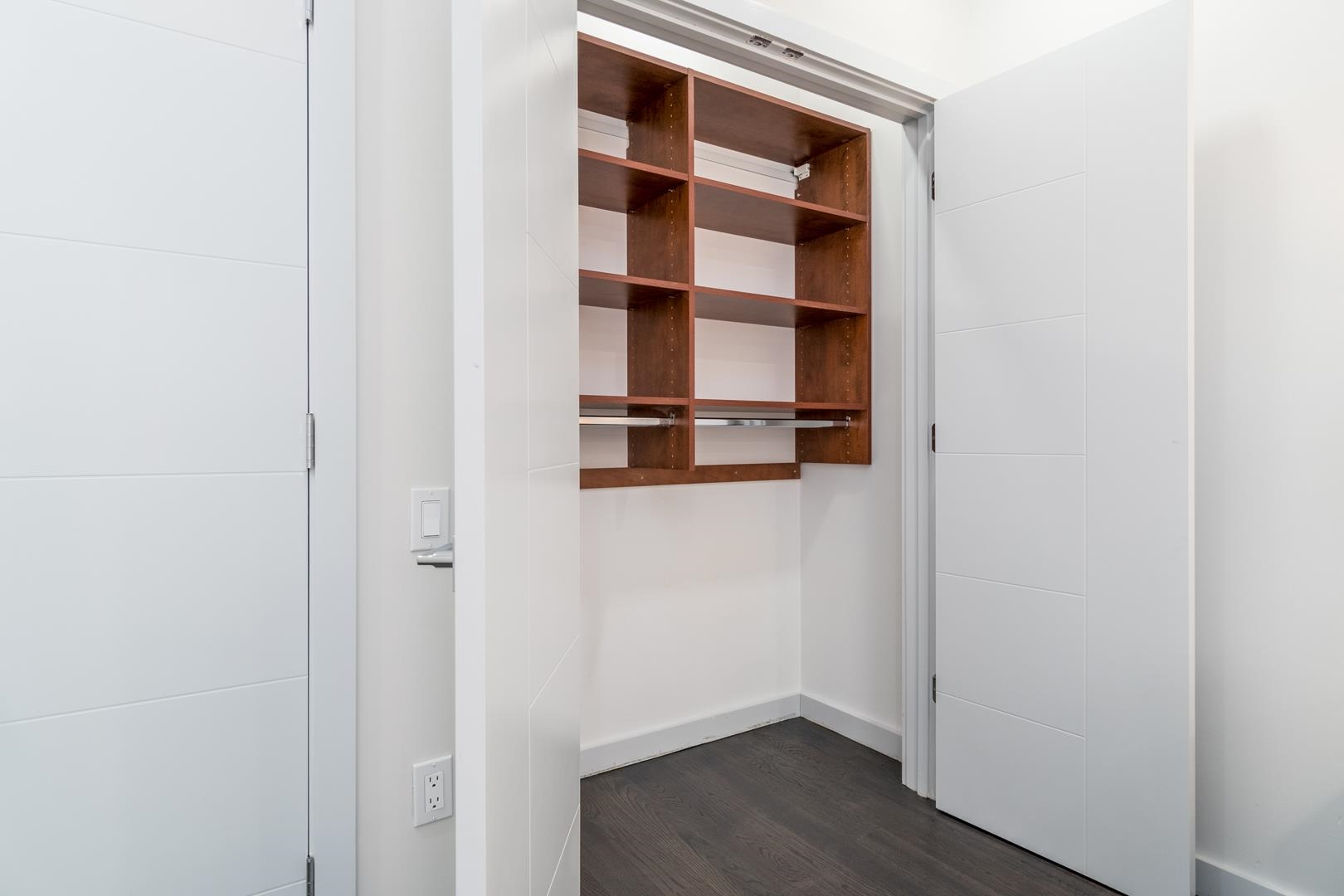 6122 Hudson Avenue, Unit 5A West New York, NJ 07093 - Photo 15 of 29 a view of cabinet with wooden floor