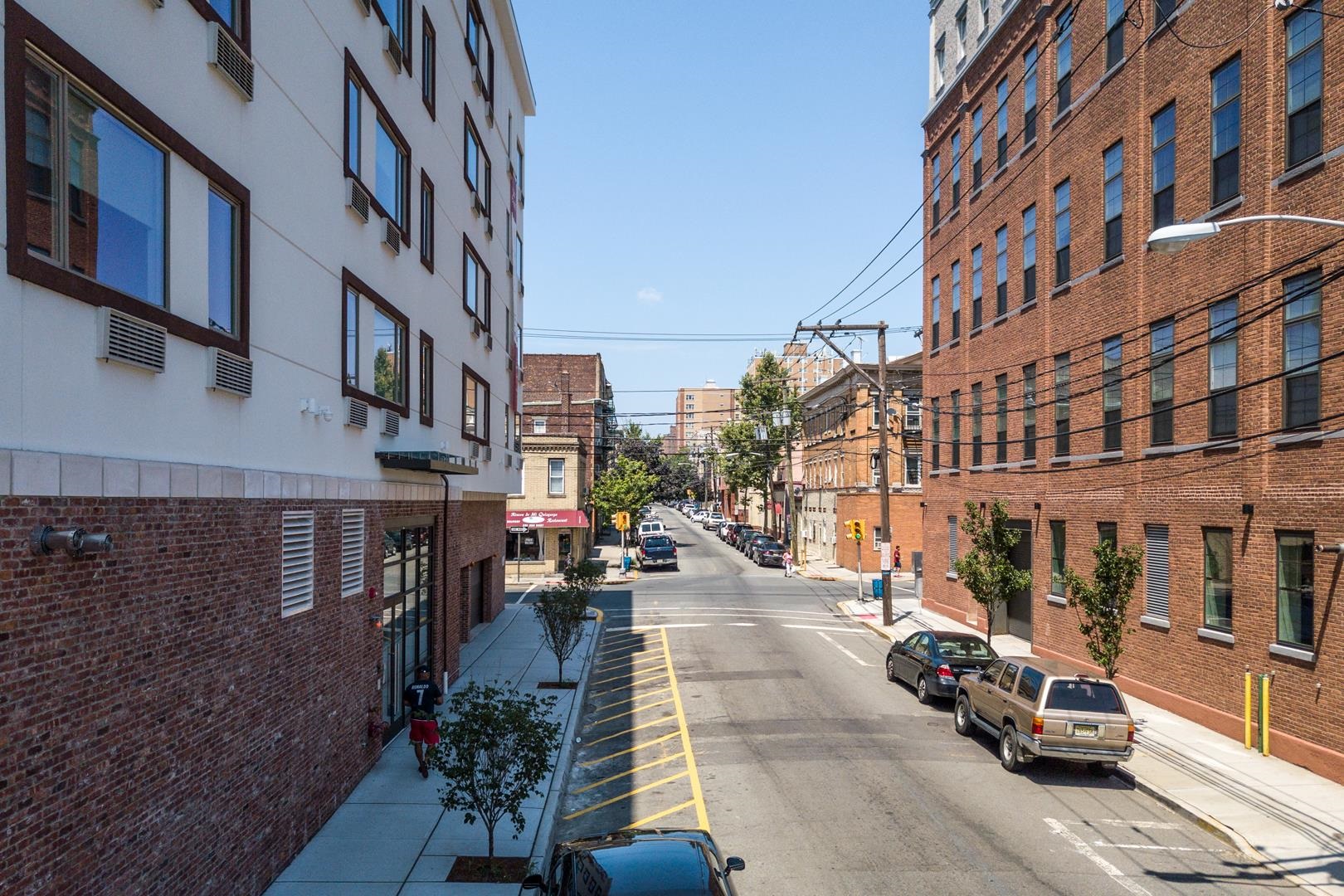 6122 Hudson Avenue, Unit 5A West New York, NJ 07093 - Photo 28 of 29 a city street lined with tall buildings