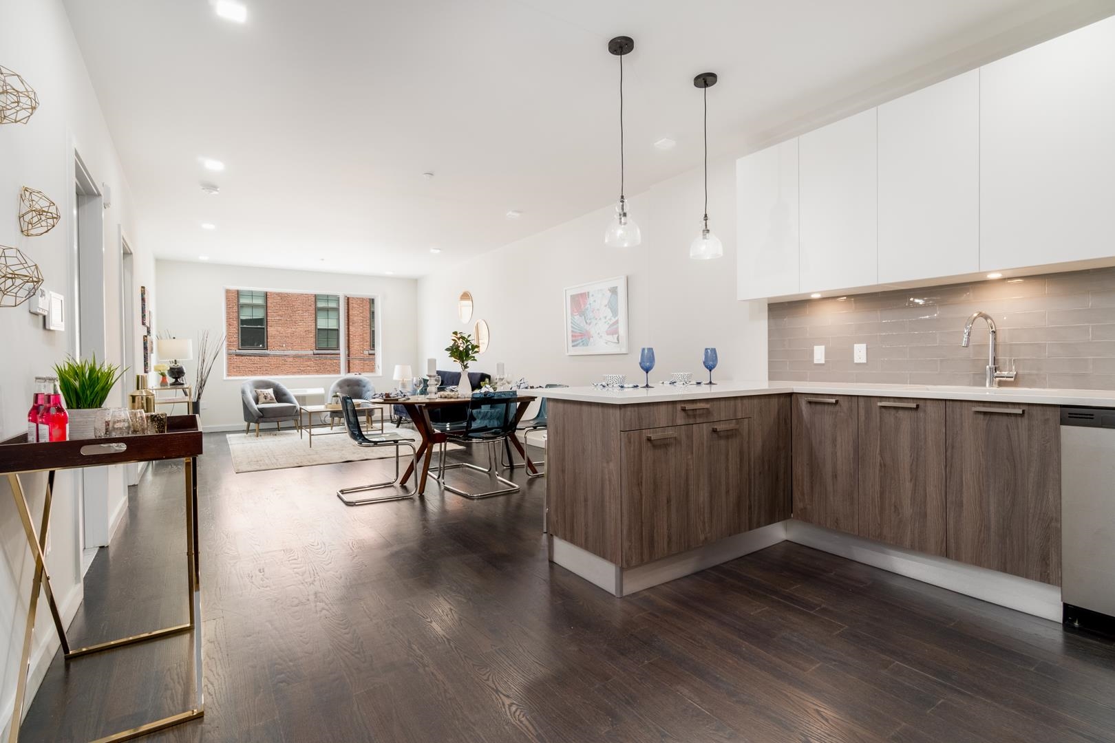 6122 Hudson Avenue, Unit 5A West New York, NJ 07093 - Photo 4 of 29 a living room with stainless steel appliances kitchen island granite countertop furniture a sink a refrigerator and wooden floor