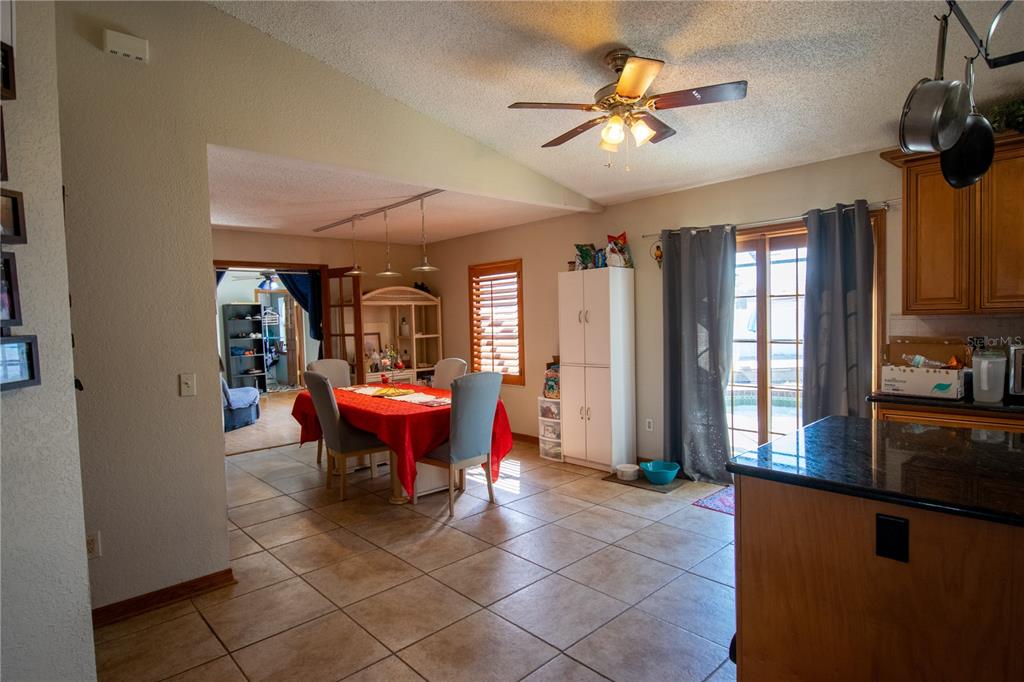 6219 Coliseum Boulevard Port Charlotte, FL 33981 - Photo 17 of 48 a dining room with furniture and window