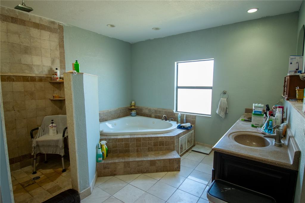 6219 Coliseum Boulevard Port Charlotte, FL 33981 - Photo 24 of 48 a bathroom with a sink and a window