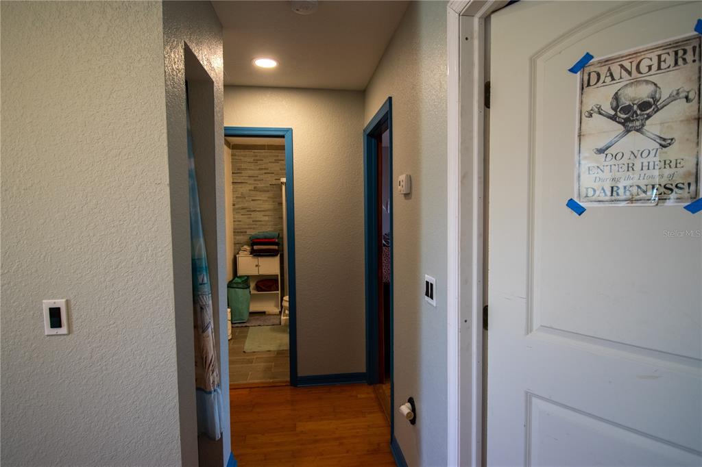 6219 Coliseum Boulevard Port Charlotte, FL 33981 - Photo 29 of 48 a view of a hallway with wooden floor and closet