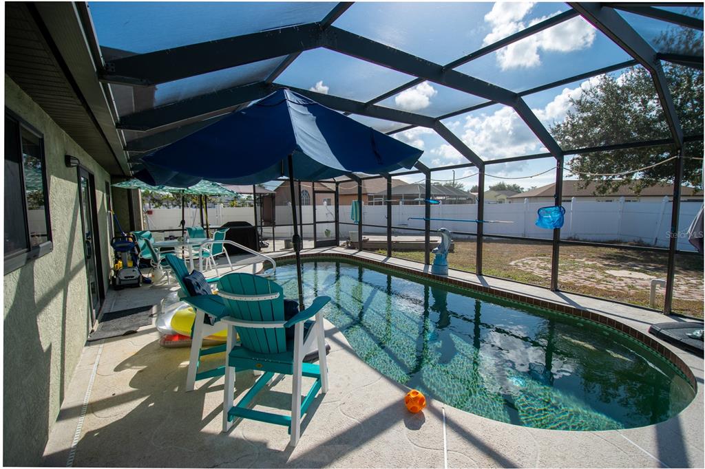 6219 Coliseum Boulevard Port Charlotte, FL 33981 - Photo 36 of 48 a view of swimming pool with outdoor seating