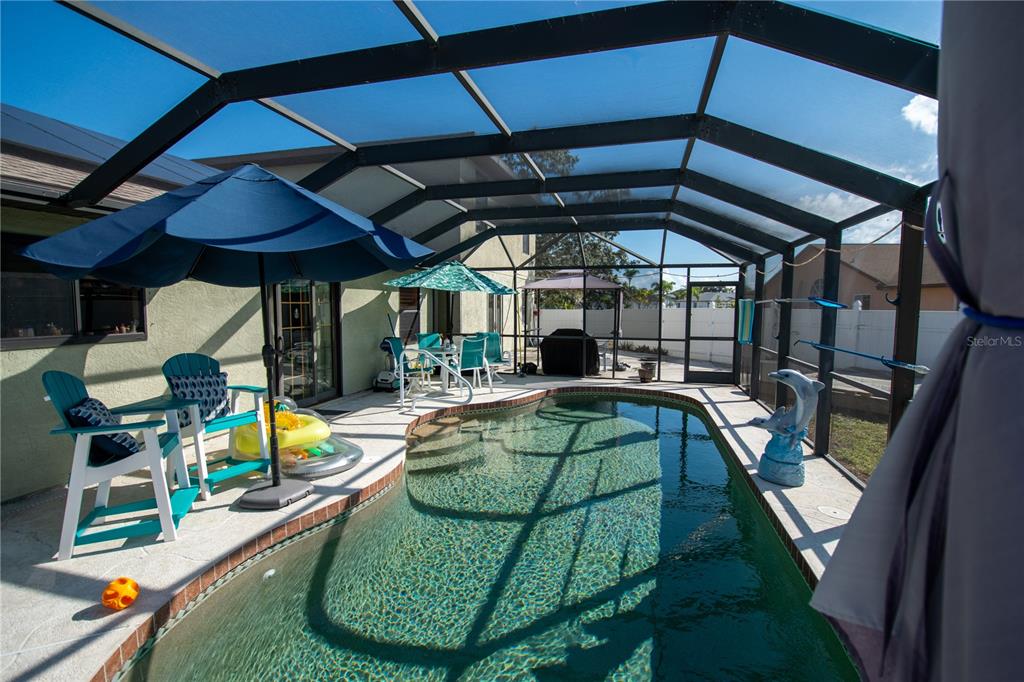 6219 Coliseum Boulevard Port Charlotte, FL 33981 - Photo 37 of 48 an outdoor view of a swimming pool
