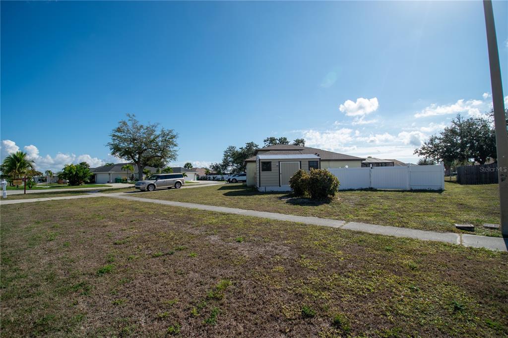 6219 Coliseum Boulevard Port Charlotte, FL 33981 - Photo 42 of 48 a view of a house with a yard
