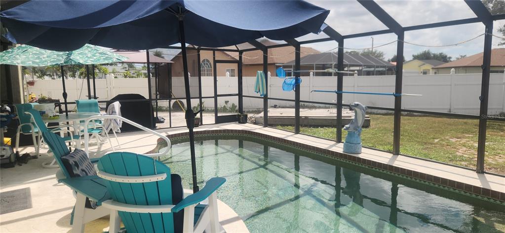 6219 Coliseum Boulevard Port Charlotte, FL 33981 - Photo 46 of 48 a view of swimming pool with outdoor seating