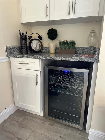 a kitchen with granite countertop stainless steel appliances stove and cabinets