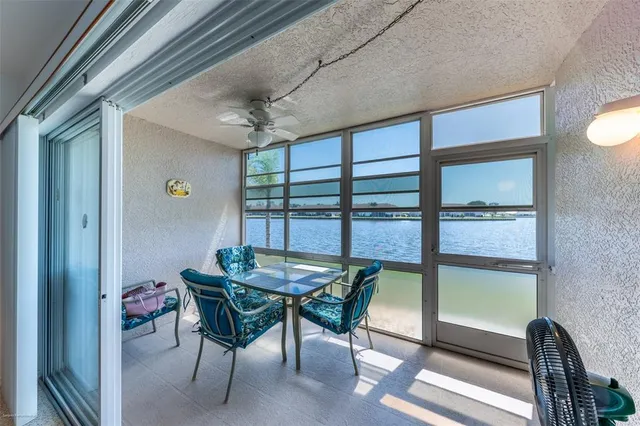 a view of a living room and floor to ceiling window or dining room