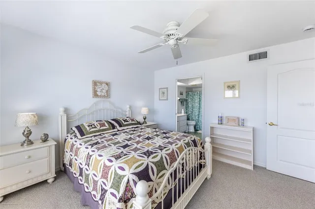 a bathroom with a double vanity sink toilet and shower