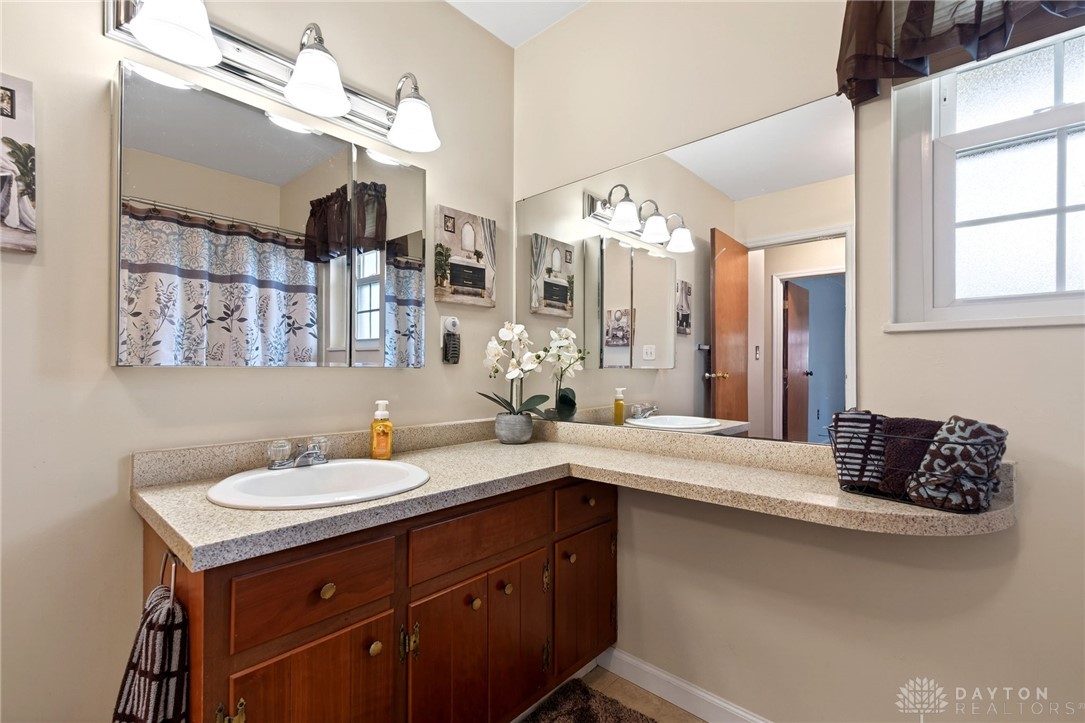 5907 Red Coach Road Dayton, OH 45429 - Photo 41 of 50 This bathroom features dual vanities and bright lighting, perfect for a fresh start to your day.
