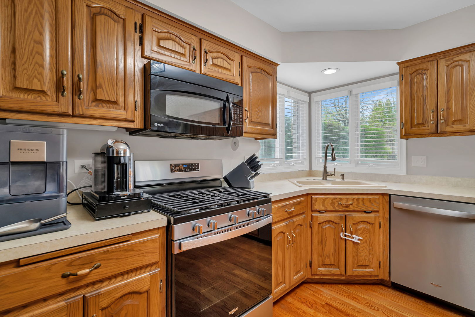 6 West Wend Street Lemont, IL 60439 - Photo 13 of 31 a kitchen with granite countertop cabinets stainless steel appliances and a sink