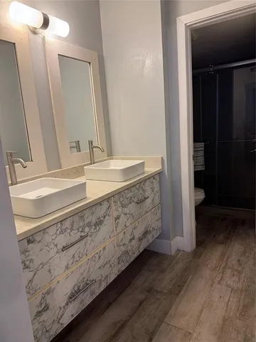 a bathroom with a shower and a toilet