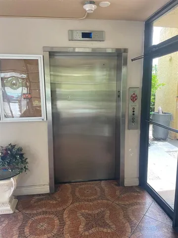 a view of house with outdoor space and swimming pool