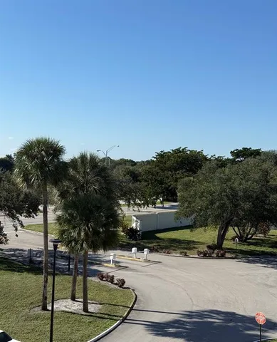a swimming pool view with mountain view