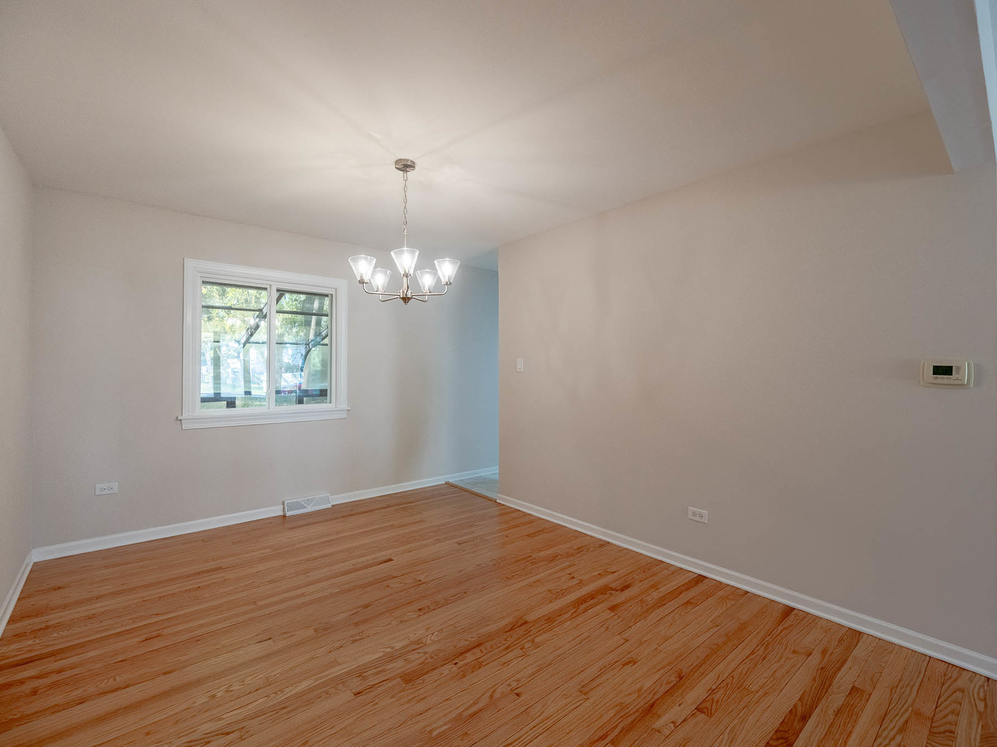 7104 Blackburn Avenue Downers Grove, IL 60516 - Photo 3 of 17 a view of empty room with wooden floor