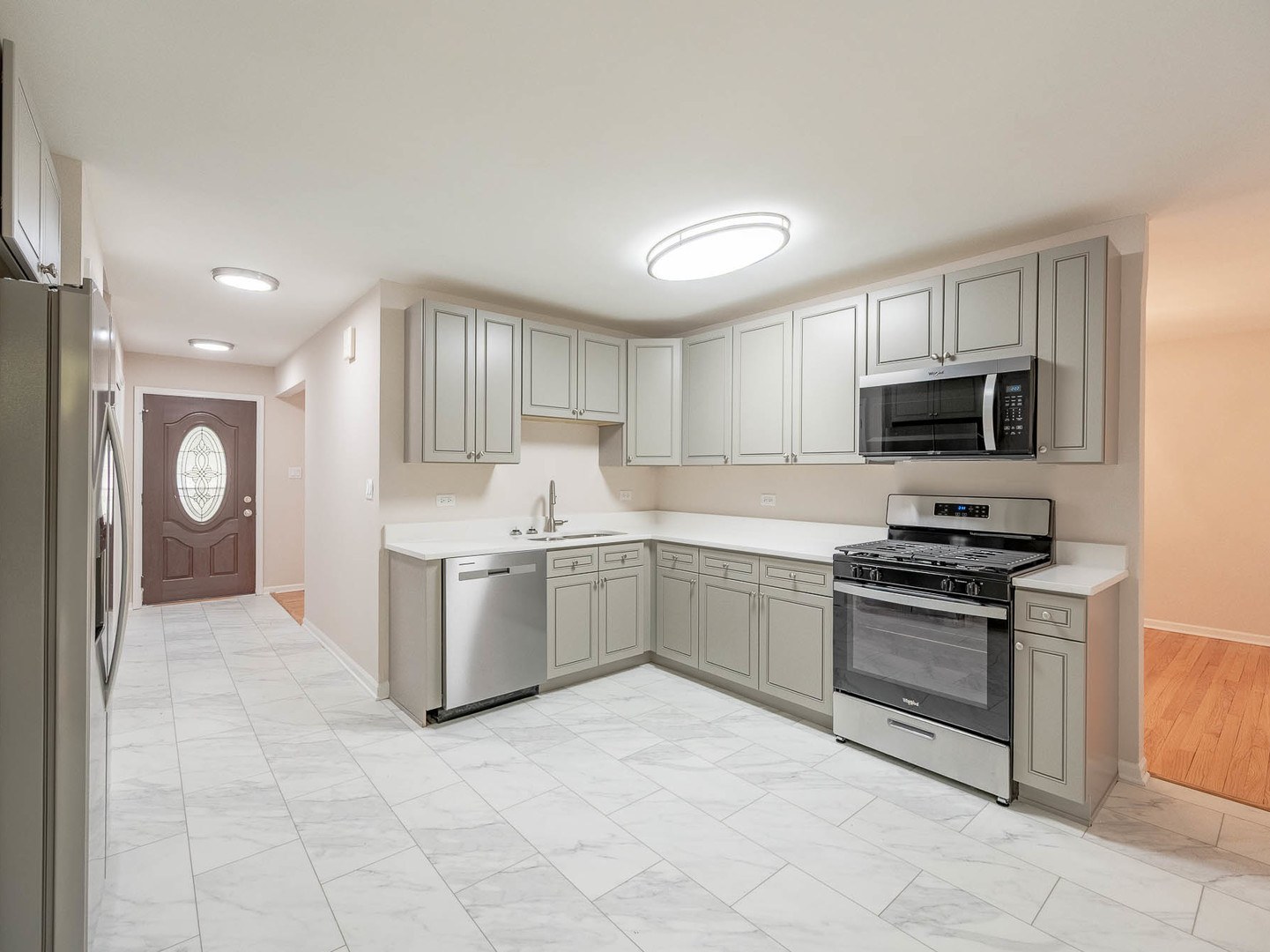 7104 Blackburn Avenue Downers Grove, IL 60516 - Photo 4 of 17 a kitchen with a stove top oven and cabinets