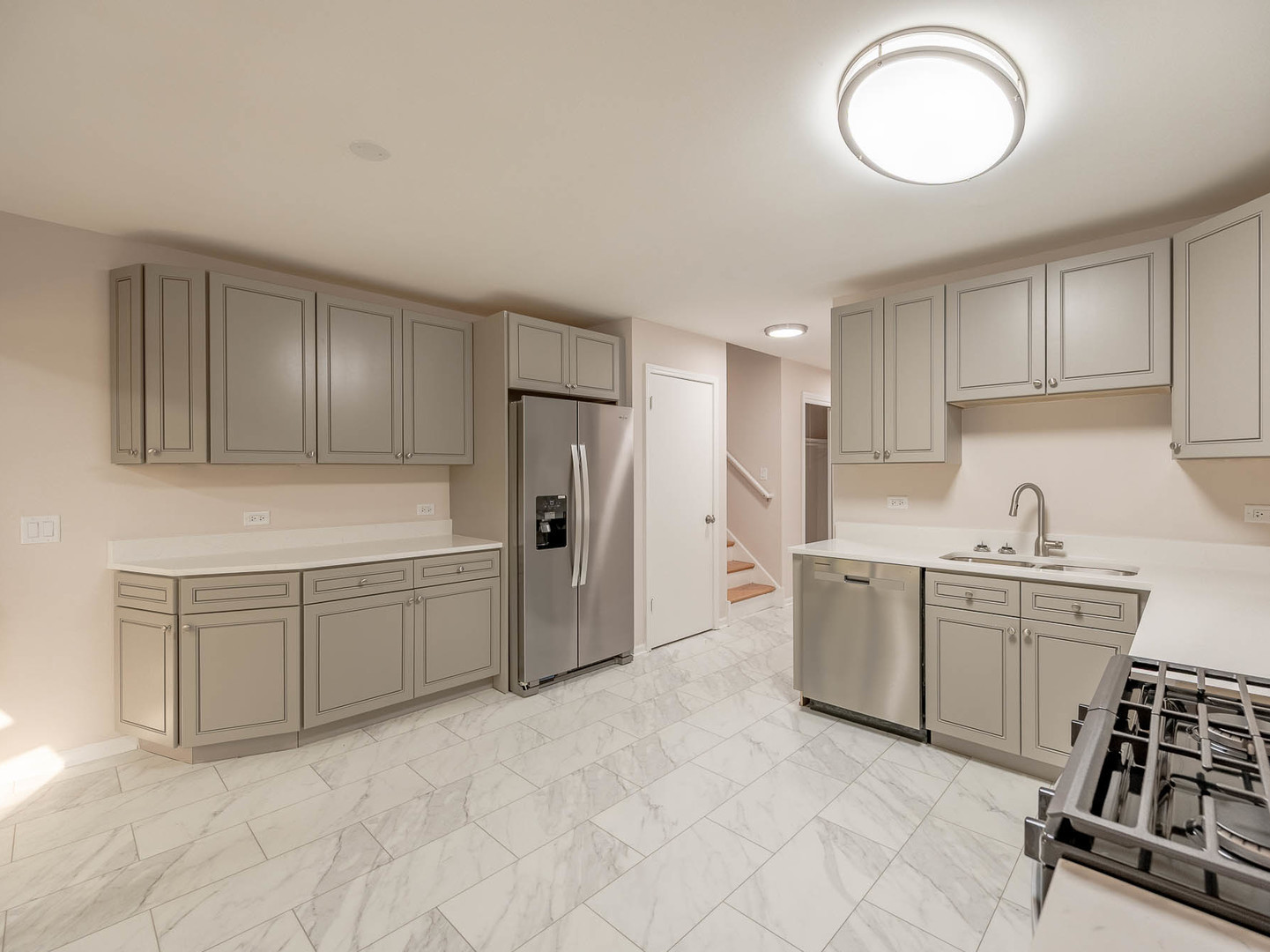 7104 Blackburn Avenue Downers Grove, IL 60516 - Photo 5 of 17 a kitchen with cabinets and stainless steel appliances