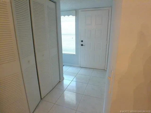 a kitchen with a sink a stove and cabinets