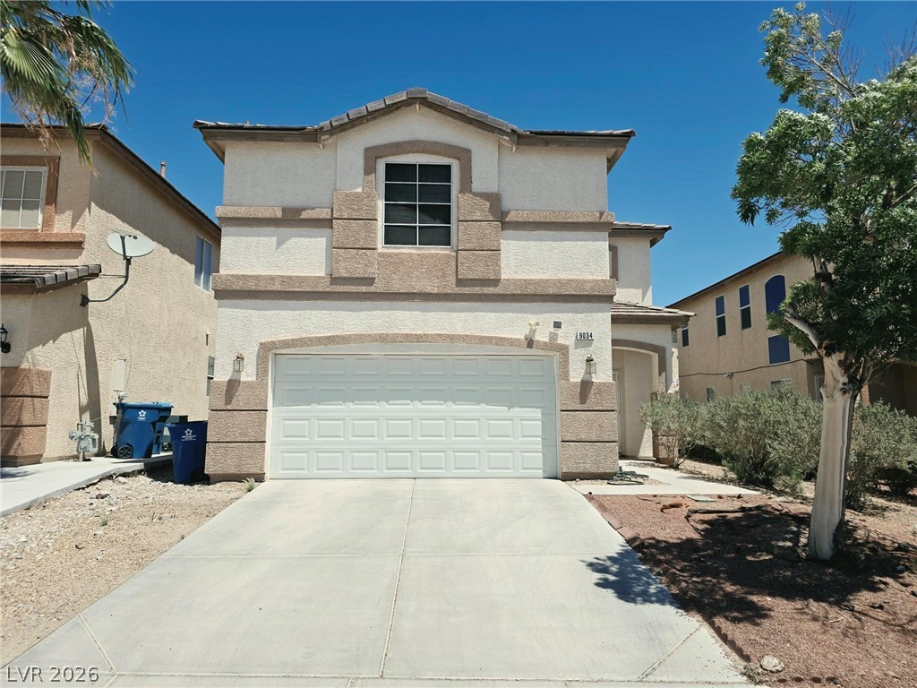 A well-maintained facade with an attached garage offers appealing curb appeal.